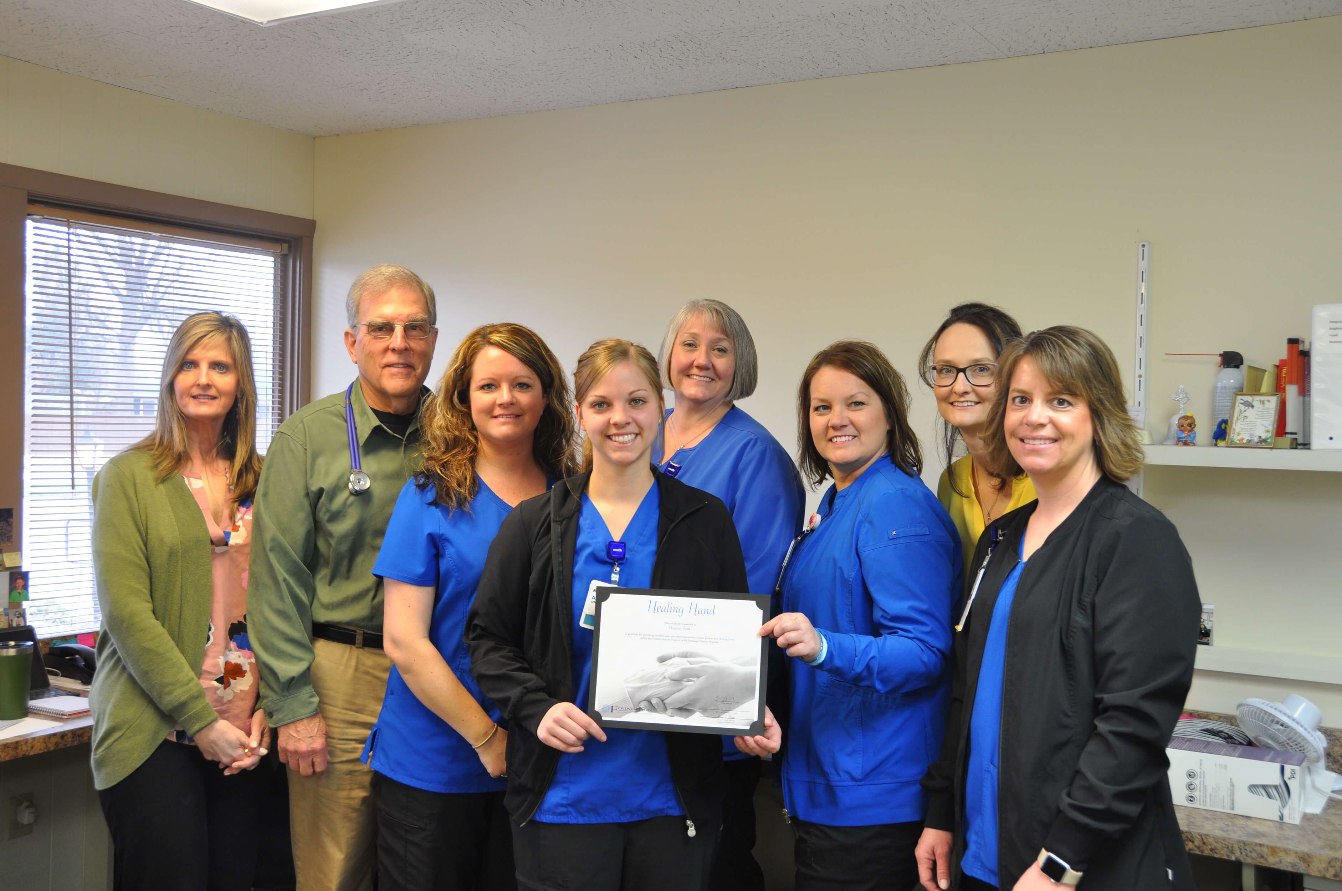 hospice staff with award