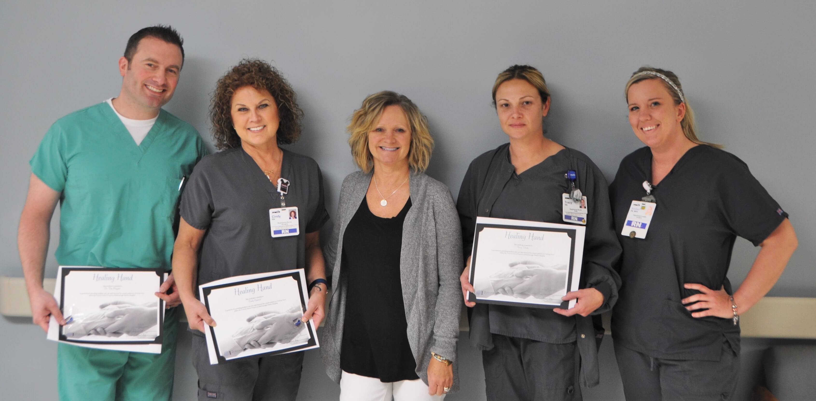surgical team with award